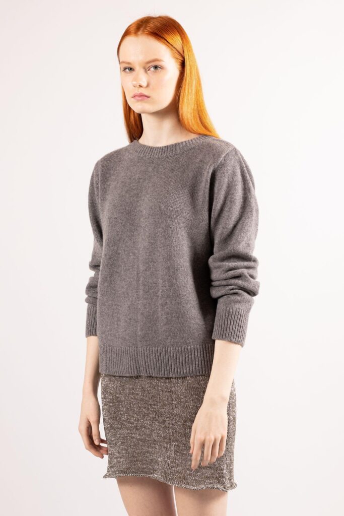 Grey Sweater Outfits for Women: Styling Ideas for Every Occasion 4 Introducing the 'JENNY' by Krista Elsta, a grey cashmere crew neck sweater that exudes warmth and style with its refined 2-ply knit and charming ribbed bottom.
