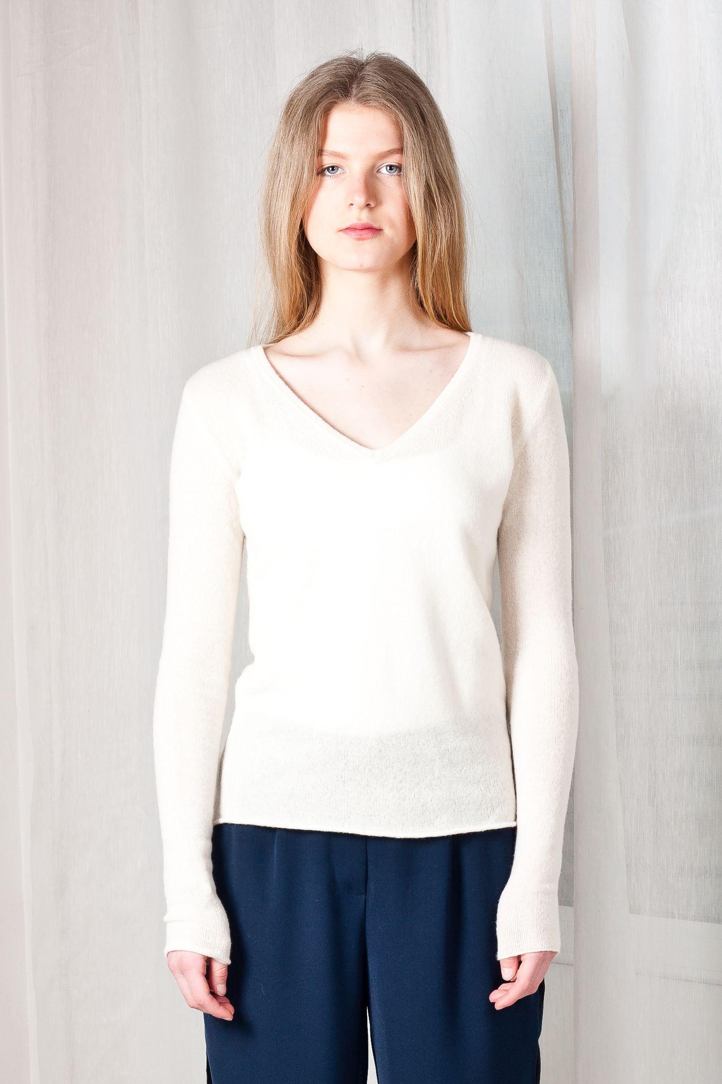Elevate your style with MARGO V, Krista Elsta's off-white cashmere V-neck sweater. Unparalleled comfort and sophistication in one chic wardrobe staple.