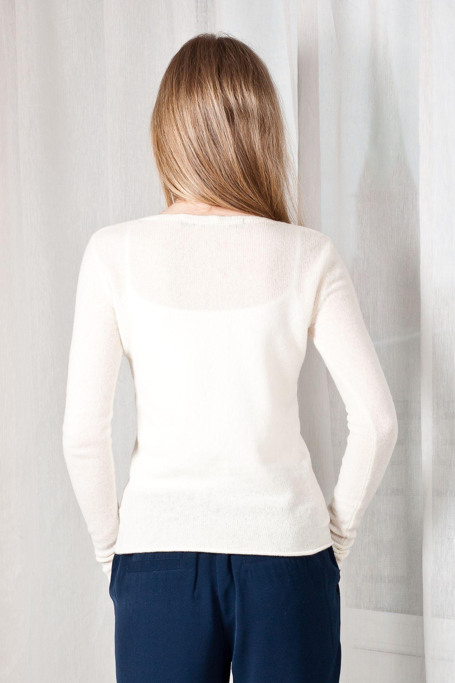 Experience the allure of MARGO V, Krista Elsta's off-white cashmere V-neck sweater. A perfect blend of comfort and chic style for any occasion.