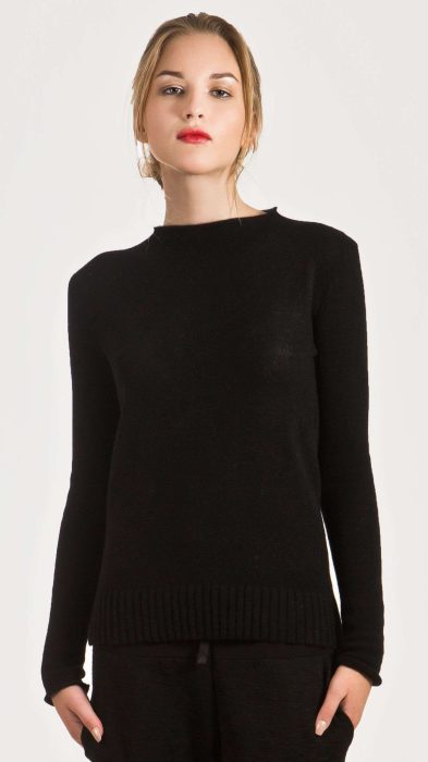 Black cashmere crew neck sweater paired with black pants