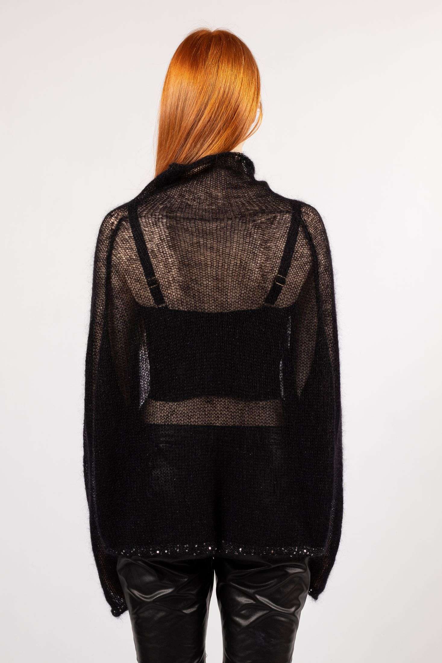 Discover the perfect blend of style and comfort with our black mohair sweater for women, accentuated by long sleeves and a touch of transparent allure.