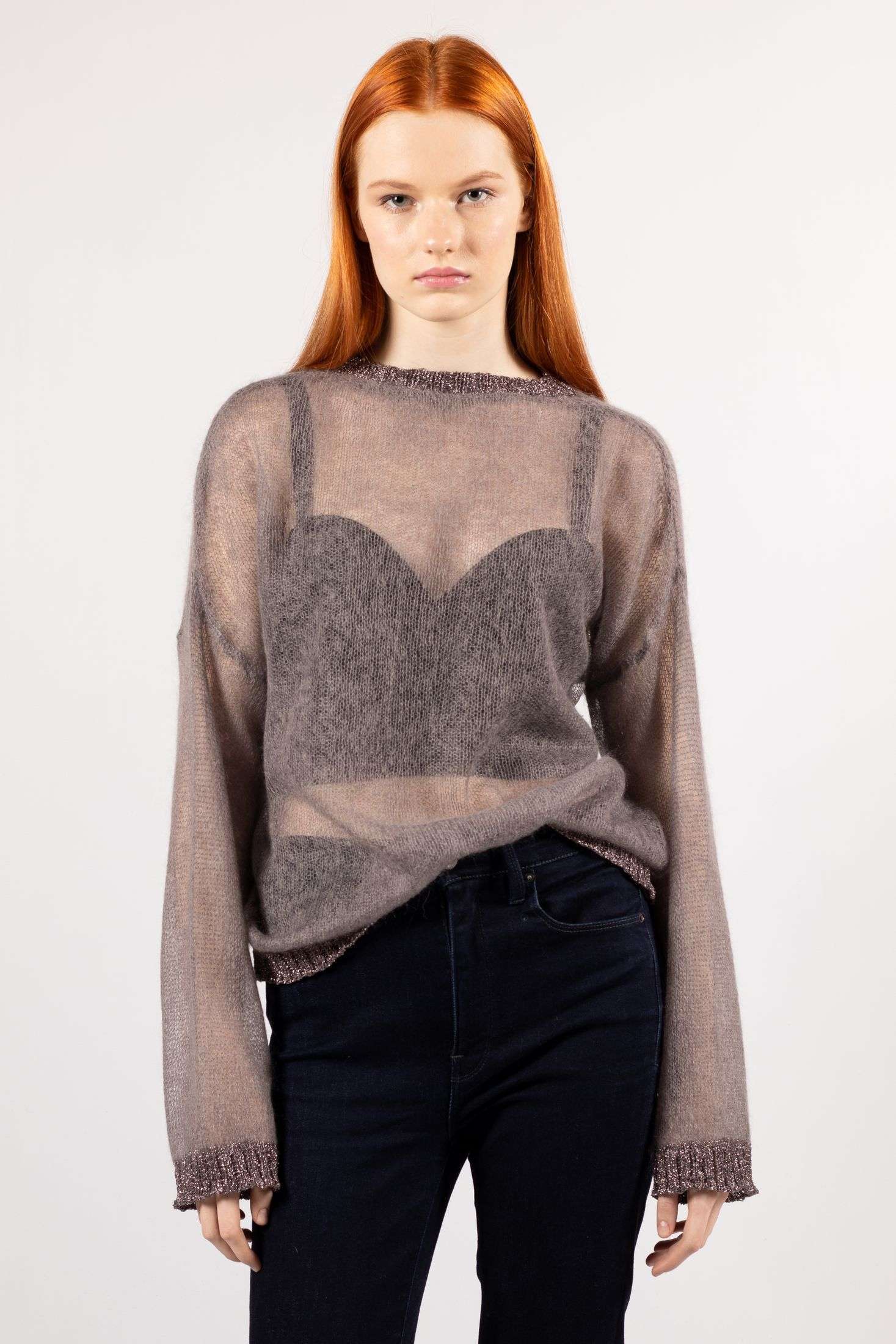 Luna: Make a statement in the chilly season with this brown sweater—transparent knit allure.